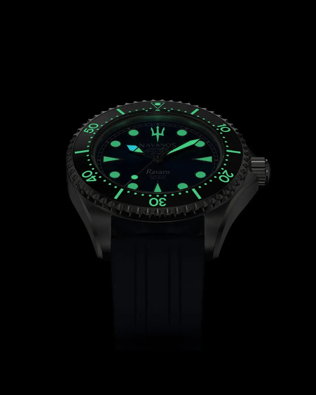 Navanos Ravaro Swiss automatic dive watch in complete darkness with powerful green Super-LumiNova lume fully illuminating the blue sunburst dial, cream markers, hands, trident logo, and bezel pip, paired with navy blue FKM rubber strap, 300m water resistance, COSC-certified Soprod P024 movement, angled studio lume shot on black background.