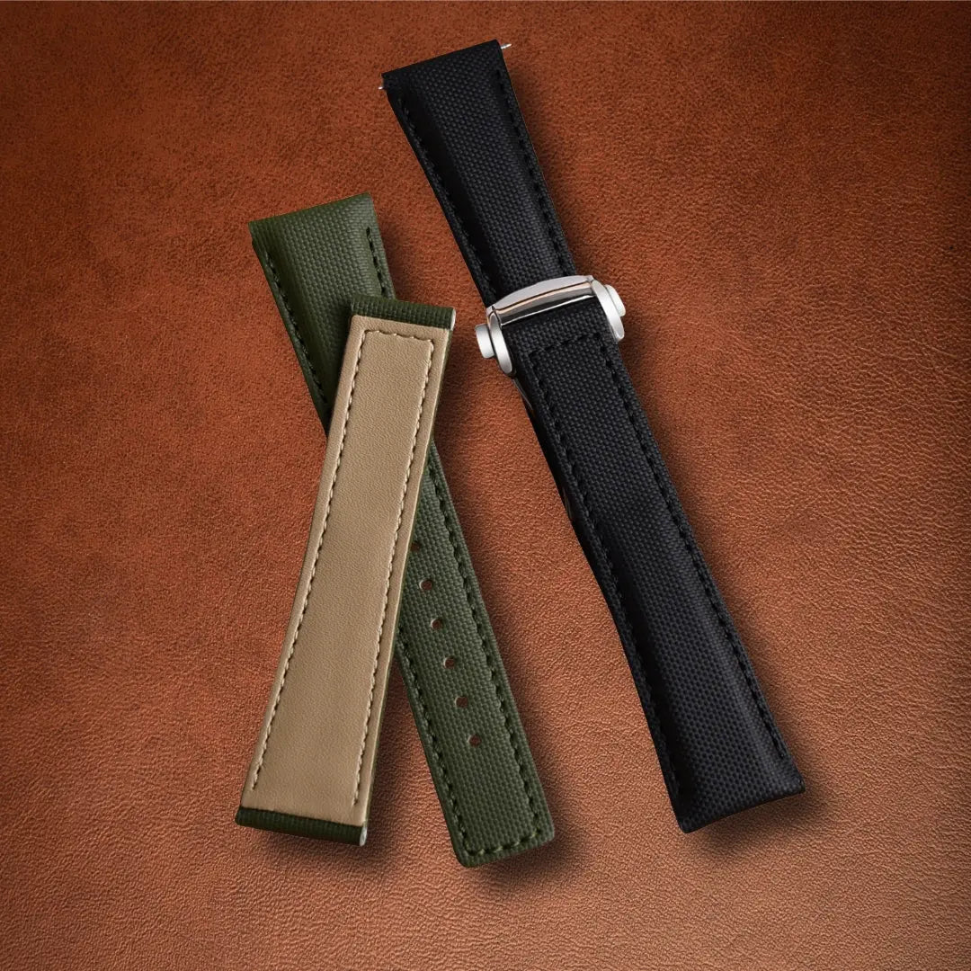 Luxury black and khaki green sailcloth watch straps featuring cream leather interior and polished butterfly buckle.