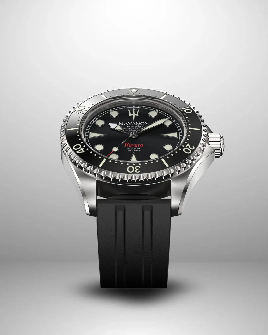 Navanos Ravaro Swiss automatic dive watch with black dial, cream luminous markers and hands, red "Ravaro" script, black ceramic unidirectional bezel, 300m water resistance, COSC-certified Soprod P024 movement, sapphire crystal, and black FKM rubber strap, angled studio shot on light gray background.