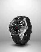 Navanos Ravaro Swiss automatic dive watch side view highlighting black dial with cream luminous markers and hands, red "Ravaro" script, black ceramic unidirectional bezel, signed crown with protectors, 300m water resistance, COSC-certified Soprod P024 movement, and black FKM rubber strap, studio shot on light gray background.