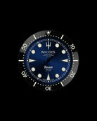 Navanos Ravaro dive watch dial and bezel close-up featuring blue sunburst dial with cream luminous markers, trident logo, white "Ravaro" script, "Sport Diver 300 Meters" and "Chronometer Officially Certified ISO 6425" text, black ceramic unidirectional bezel insert with cream numerals, and luminous pip at 12 o'clock, on black background.