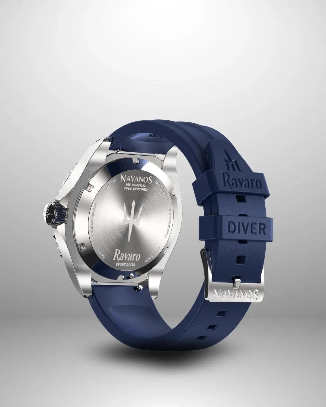 Navanos Ravaro Swiss automatic dive watch caseback view showing engraved trident logo, "Ravaro Sport Diver" script, COSC-certified marking, solid screw-down stainless steel caseback, paired with navy blue FKM rubber strap featuring embossed "Ravaro DIVER" and "NAVANOS" branding, studio shot on light gray background.