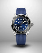 Navanos Ravaro Swiss automatic dive watch with blue sunburst dial, cream luminous markers and hands, black ceramic unidirectional bezel, 300m water resistance, COSC-certified Soprod P024 movement, sapphire crystal, and matching blue FKM rubber strap, front studio shot on light gray background.