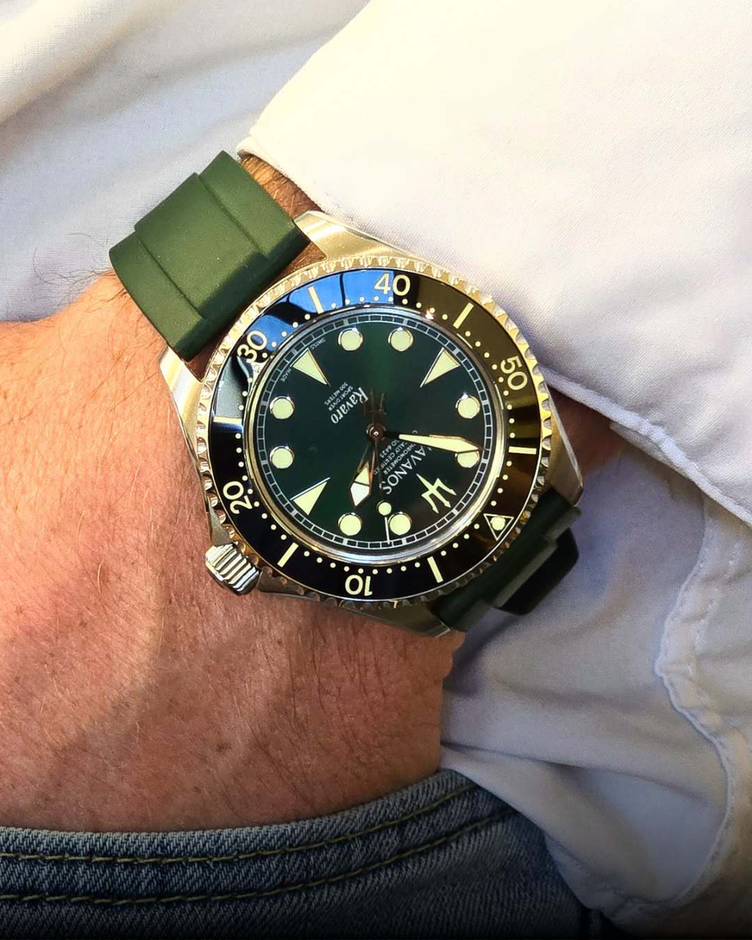 Navanos Ravaro Diver luxury dive watch with a piton green dial and green rubber strap worn on wrist in natural light.