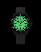 Navanos Ravaro Swiss automatic dive watch in complete darkness with full Super-LumiNova luminescence glowing bright green on the entire dial, markers, hands, and bezel pip, paired with black FKM rubber strap, 300m water resistance, COSC-certified Soprod P024 movement, studio lume shot on black background.