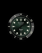 Navanos Ravaro dive watch dial and bezel close-up featuring green sunburst dial with cream luminous markers, trident logo, white "Ravaro" script, "Sport Diver 300 Meters" and "Chronometer Officially Certified ISO 6425" text, black ceramic unidirectional bezel insert with cream numerals, and luminous pip at 12 o'clock, on black background.