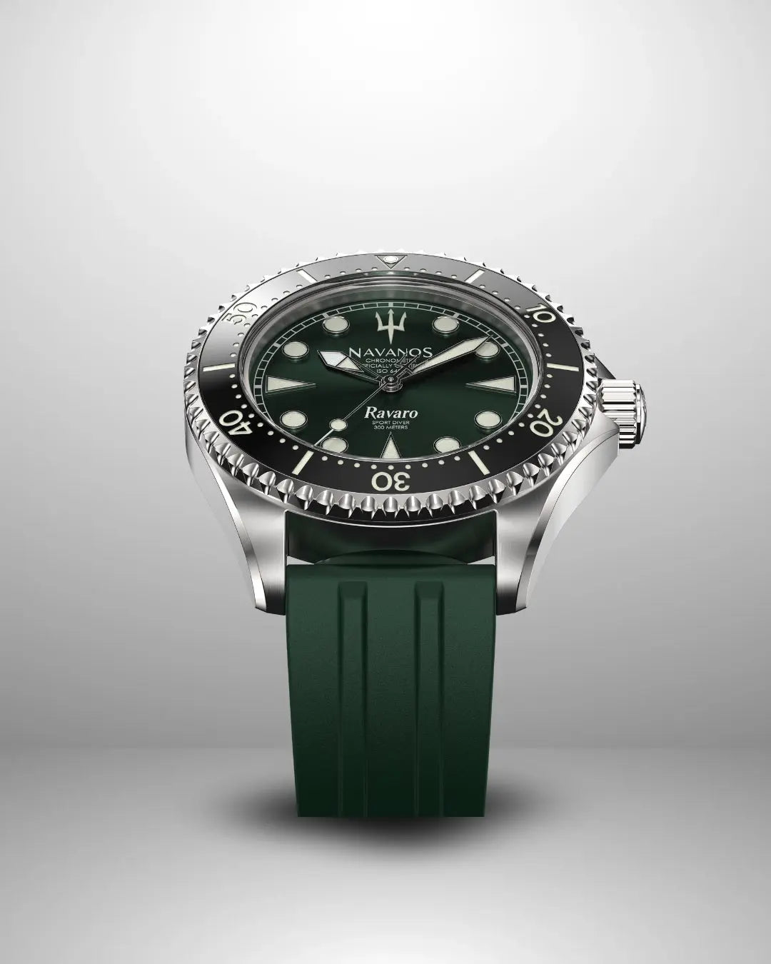 Navanos Ravaro Swiss automatic dive watch with green sunburst dial, cream luminous markers and hands, black ceramic unidirectional bezel, 300m water resistance, COSC-certified Soprod P024 movement, sapphire crystal, and matching forest green FKM rubber strap, angled studio shot on light gray background.