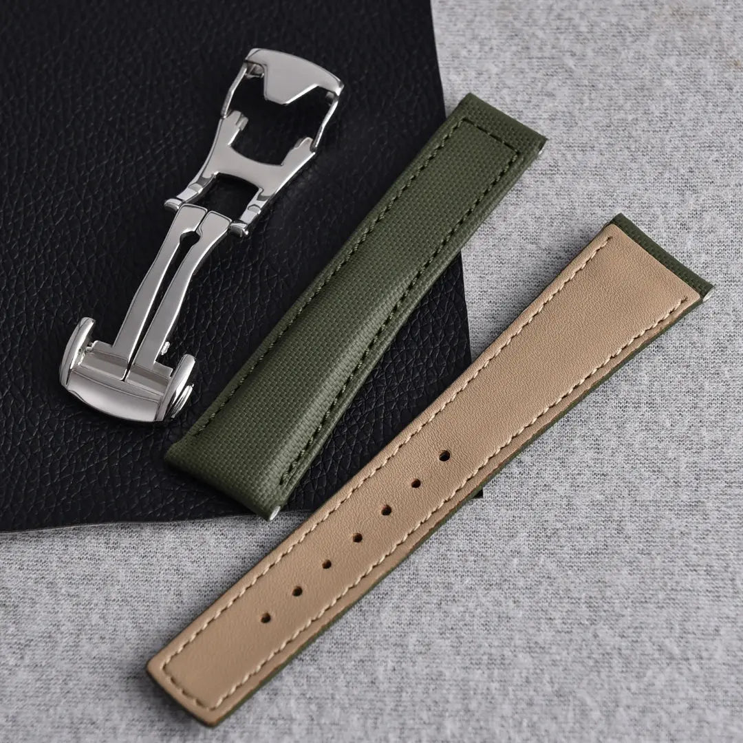 Piton green Cordura fabric watch strap with beige premium leather lining and stainless steel deployant clasp.